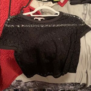 See through shirt. Cute with bathing suits.